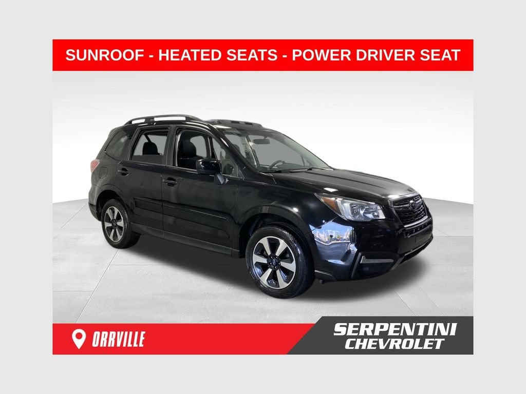 2018 Subaru Forester Premium in Black — front three-quarter view